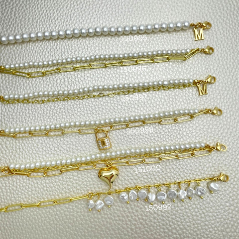 15 pulseras con clip de perla a la moda ($6,67 cada una) por $100 en capas de oro