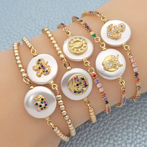 15 pulseras ajustables de nácar en capas de oro ($6.67) c/u