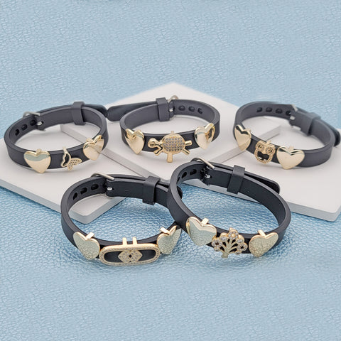 15 pulseras con dijes deslizantes surtidas en capas de oro ($6.67) c/u