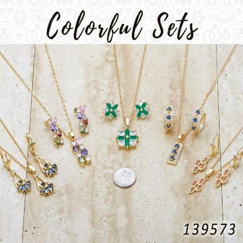 18 coloridos juegos de aretes, colgantes y collares en capas de oro ($5.55) c/u