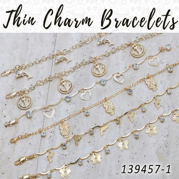 25 pulseras delgadas con dijes en capas de oro ($4.00) c/u