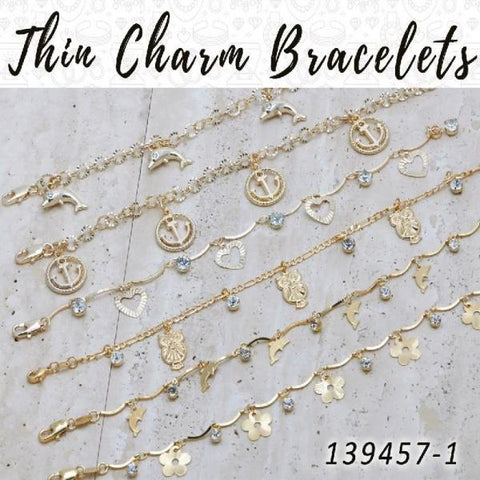 25 pulseras delgadas con dijes en capas de oro ($4.00) c/u