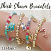 15 pulseras gruesas con dijes en capas de oro ($6.67) c/u