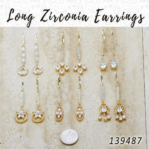 33 aretes largos de zirconio en capas de oro ($3.03) c/u