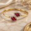 Oro Laminado Individual Bangle, Gold Filled Style Teardrop Design, with Garnet and White Cubic Zirconia, Polished, Golden Finish, 5.231.014 (05 MM Thickness, One size fits all)