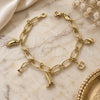 Oro Laminado Charm Bracelet, Gold Filled Style Apple and Shoes Design, Diamond Cutting Finish, Golden Finish, 5.021.010.1 (08 MM Thickness, 7 Inches Length)