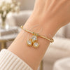 Oro Laminado Individual Bangle, Gold Filled Style Flower Design, with White Cubic Zirconia, Polished, Golden Finish, 07.63.0200 (02 MM Thickness, One size fits all)