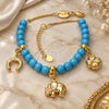 Oro Laminado Charm Bracelet, Gold Filled Style Elephant and Four-leaf Clover Design, with Blue Topaz Opal, Polished, Golden Finish, 03.32.0081.2.08 (8 Inches Length)