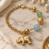 Oro Laminado Charm Bracelet, Gold Filled Style Elephant and Ball Design, with Dark Apple Green and Aquamarine Opal, Polished, Golden Finish, 03.32.0114.07 (7 Inches Length)