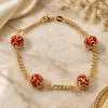 Oro Laminado Fancy Bracelet, Gold Filled Style Ball and Miami Cuban Design, with Garnet Crystal, Polished, Golden Finish, 03.32.0157.2 (04 MM Thickness, 7 Inches Length)