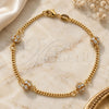 Oro Laminado Fancy Bracelet, Gold Filled Style Ball and Miami Cuban Design, with White Cubic Zirconia, Polished, Golden Finish, 03.32.0170.07 (03 MM Thickness, 7 Inches Length)