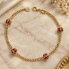 Oro Laminado Fancy Bracelet, Gold Filled Style Ball and Miami Cuban Design, with Ruby Cubic Zirconia, Polished, Golden Finish, 03.32.0170.07.1 (03 MM Thickness, 7 Inches Length)