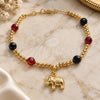 Oro Laminado Charm Bracelet, Gold Filled Style Elephant and Ball Design, with Black Azavache and Ruby Crystal, Polished, Golden Finish, 03.32.0228.07 (7 Inches Length)