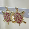 Oro Laminado Huggie Hoop, Gold Filled Style Turtle Design, with Pink and White Crystal, Polished, Golden Finish, 02.348.0001.4.15