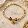 Oro Laminado Charm Bracelet, Gold Filled Style Elephant Design, with Garnet and Black Crystal, Polished, Golden Finish, 03.63.2076.1.08 (04 MM Thickness, 8 Inches Length)