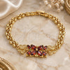 Oro Laminado Fancy Bracelet, Gold Filled Style Flower and Butterfly Design, with Garnet Cubic Zirconia, Polished, Golden Finish, 03.357.0014.2.07 (06 MM Thickness, 7 Inches Length)