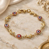Oro Laminado Fancy Bracelet, Gold Filled Style Evil Eye and Dolphin Design, Red Resin Finish, Golden Finish, 03.326.0009.1.06 (07 MM Thickness, 6 Inches Length)