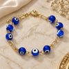 Oro Laminado Fancy Bracelet, Gold Filled Style Evil Eye Design, with Dark Tanzanite Opal, Blue Resin Finish, Golden Finish, 03.63.2069.1.08 (04 MM Thickness, 8 Inches Length)