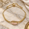 Oro Laminado Adjustable Bolo Bracelet, Gold Filled Style Shell Design, with White Cubic Zirconia, Pink Enamel Finish, Golden Finish, 03.63.2089.1.10 (01 MM Thickness, 10 Inches Length)