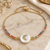 Oro Laminado Adjustable Bolo Bracelet, Gold Filled Style Moon Design, with White and Multicolor Cubic Zirconia, Polished, Golden Finish, 03.63.2120.10 (01 MM Thickness, 10 Inches Length)