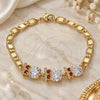 Oro Laminado Fancy Bracelet, Gold Filled Style Owl Design, with Garnet and White Cubic Zirconia, Polished, Golden Finish, 03.63.2135.07 (05 MM Thickness, 7 Inches Length)