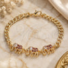 Oro Laminado Fancy Bracelet, Gold Filled Style Elephant Design, with Garnet and White Cubic Zirconia, Polished, Golden Finish, 03.63.2138.1.07 (05 MM Thickness, 7 Inches Length)
