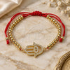 Oro Laminado Fancy Bracelet, Gold Filled Style Hand of God and Ball Design, with White and Black Micro Pave, Polished, Golden Finish, 03.207.0118.11 (04 MM Thickness, 11 Inches Length)