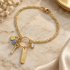 Oro Laminado Charm Bracelet, Gold Filled Style key and Mariner Design, with White Cubic Zirconia, Polished, Golden Finish, 03.32.0266.07