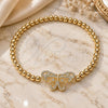 Oro Laminado Fancy Bracelet, Gold Filled Style Expandable Bead and Butterfly Design, with White Micro Pave, Polished, Golden Finish, 03.299.0045.07 (04 MM Thickness, 7 Inches Length)