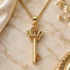 Oro Laminado Pendant Necklace, Gold Filled Style key and Crown Design, with Garnet Micro Pave, Polished, Golden Finish, 04.344.0009.1.20 (02 MM Thickness, 20 Inches Length)