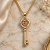 Oro Laminado Pendant Necklace, Gold Filled Style key and Heart Design, with Garnet Micro Pave, Polished, Golden Finish, 04.344.0013.1.20 (02 MM Thickness, 20 Inches Length)