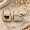 Oro Laminado Huggie Hoop, Gold Filled Style Lock and Heart Design, with White Micro Pave, Black Enamel Finish, Golden Finish, 02.213.0210.10