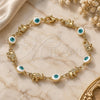 Oro Laminado Fancy Bracelet, Gold Filled Style Evil Eye and Elephant Design, White Enamel Finish, Golden Finish, 03.351.0107.3.07 (06 MM Thickness, 7 Inches Length)