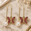 Oro Laminado Threader Earring, Gold Filled Style Butterfly Design, with Garnet Crystal, Polished, Golden Finish, 02.380.0068.1