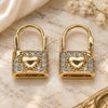 Oro Laminado Huggie Hoop, Gold Filled Style Lock and Heart Design, with White Cubic Zirconia, Polished, Golden Finish, 02.210.0525.10