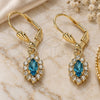 Oro Laminado Dangle Earring, Gold Filled Style with Blue Topaz and White Crystal, Polished, Golden Finish, 02.122.0115.8