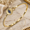 Oro Laminado Individual Bangle, Gold Filled Style Evil Eye Design, with Sapphire Blue Micro Pave and White Crystal, Polished, Golden Finish, 07.193.0038.1.04 (02 MM Thickness, Size 4 (2.25 Diameter))