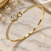 Oro Laminado Individual Bangle, Gold Filled Style Dolphin Design, with White Cubic Zirconia and Black Micro Pave, Polished, Golden Finish, 07.193.0039.04 (02 MM Thickness, Size 4 (2.25 Diameter))