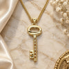 Oro Laminado Pendant Necklace, Gold Filled Style key Design, with Garnet and White Micro Pave, Polished, Golden Finish, 04.156.0429.1.20 (02 MM Thickness, 20 Inches Length)