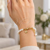 Oro Laminado Fancy Bracelet, Gold Filled Style Ball Design, with Ivory Pearl, Polished, Golden Finish, 03.405.0006.07 (07 MM Thickness, 7 Inches Length)