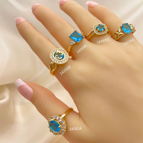 20 anillos surtidos de zirconio azul claro y aguamarina en oro laminado por $100 ($5.00 c/u) en oro laminado 