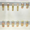 30 argollas Huggie tricolor surtidas en Oro Laminado Gold Filled ($3.33 cada una) por $100 Gold Layered 