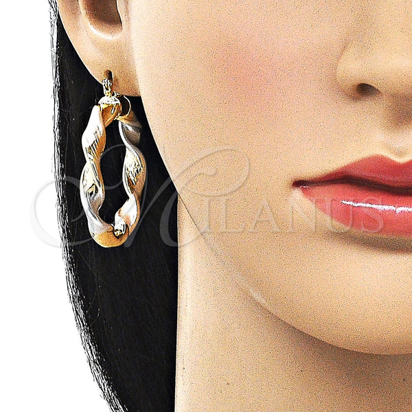 Gold Filled Hoop Earrings — Medium Hoop Twist and Hollow Design Diamond Cutting — alternate product view — SKU 161883 | Oro Laminado aretes de aro — Medium Hoop Twist and Hollow diseño Diamond Cutting — SKU 161883
