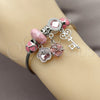 Stainless Steel Individual Bangle, key and Flower Design, with White Cubic Zirconia and Light Rose Crystal, Pink Enamel Finish, Rhodium Finish, 07.464.0031 (03 MM Thickness, One size fits all)
