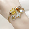 Stainless Steel Individual Bangle, Butterfly and Shell Design, with Light Smoked Topaz and Aurore Boreale Crystal, Polished, Golden Finish, 07.464.0038.1 (03 MM Thickness, One size fits all)