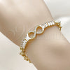 Oro Laminado Fancy Bracelet, Gold Filled Style Infinite and Baguette Design, with White Cubic Zirconia, Polished, Golden Finish, 03.266.0078.08 (07 MM Thickness, 8 Inches Length)