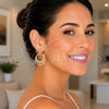 Model wearing Gold Filled Style teardrop hoop earrings with white cubic zirconia, SKU 167914