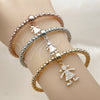 Oro Laminado Trio Bangle, Gold Filled Style Ball and Little Girl Design, with White Cubic Zirconia, Polished, Tricolor, 07.282.0125 (Thickness, One size fits all)